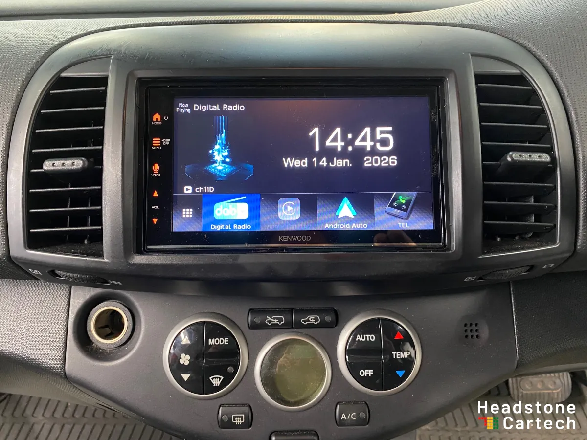 Professional Apple CarPlay installation completed in vehicle dashboard showing modern touchscreen interface