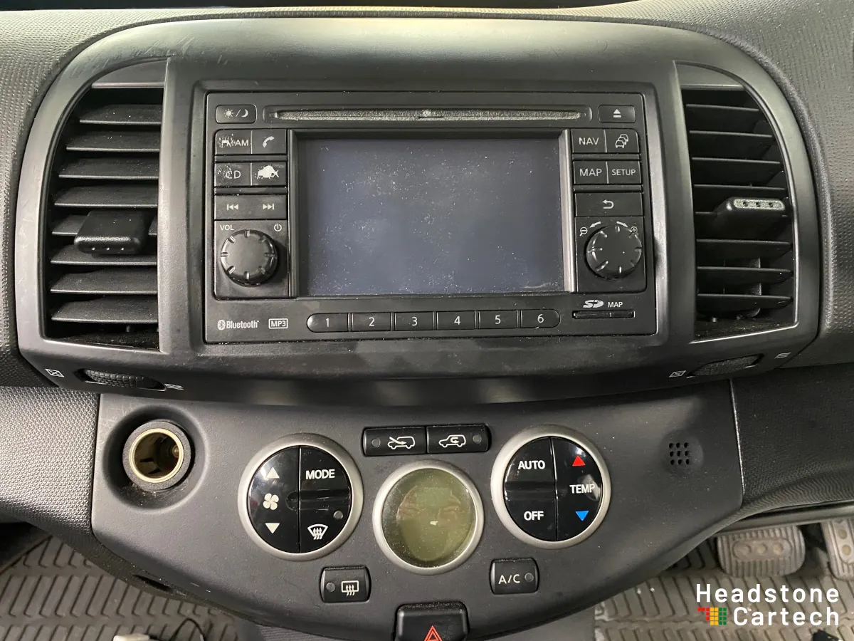 Original factory-fitted car stereo unit before Apple CarPlay upgrade showing dated interface